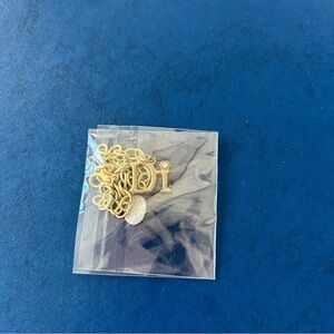 Diamond international Di Gold tone initial bracelet with diamanté detail